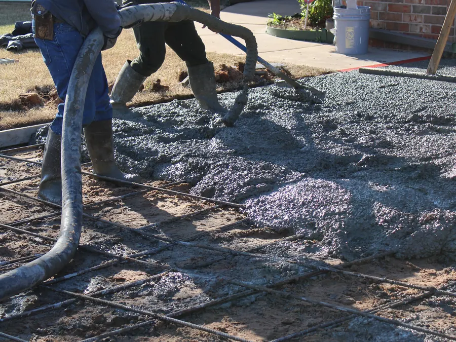 Crew pouring a concrete driveway