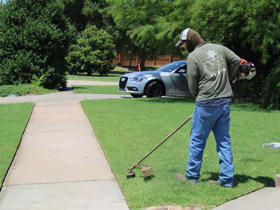 Mathew Services crew edging a lawn